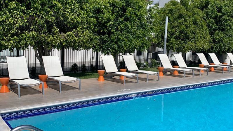 Sunbed area by the outdoor pool at Anaheim Hotel