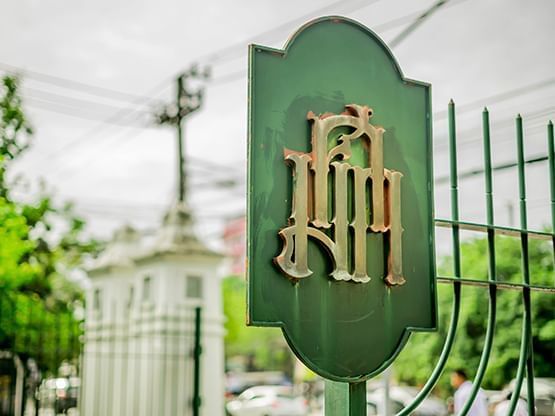 Close-up of a gate at Silpakorn University near Hop Inn Hotel