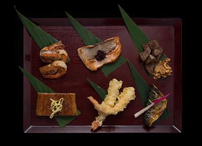 Japanese platter with grilled shrimp, fish, tempura, and meats on bamboo leaves at The Saujana Hotel Kuala Lumpur