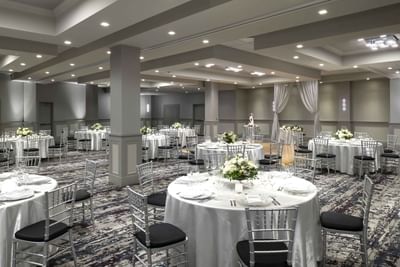 banquet room with round dining tables and chairs