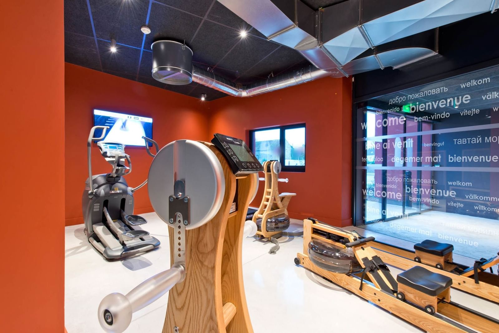 Exercise machines with the fitness center at Nomad Hotels Paris Roissy