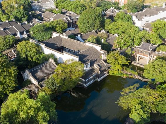 Aerial view of the hotel around with the trees on a sunny day near Grand Park Wuxi