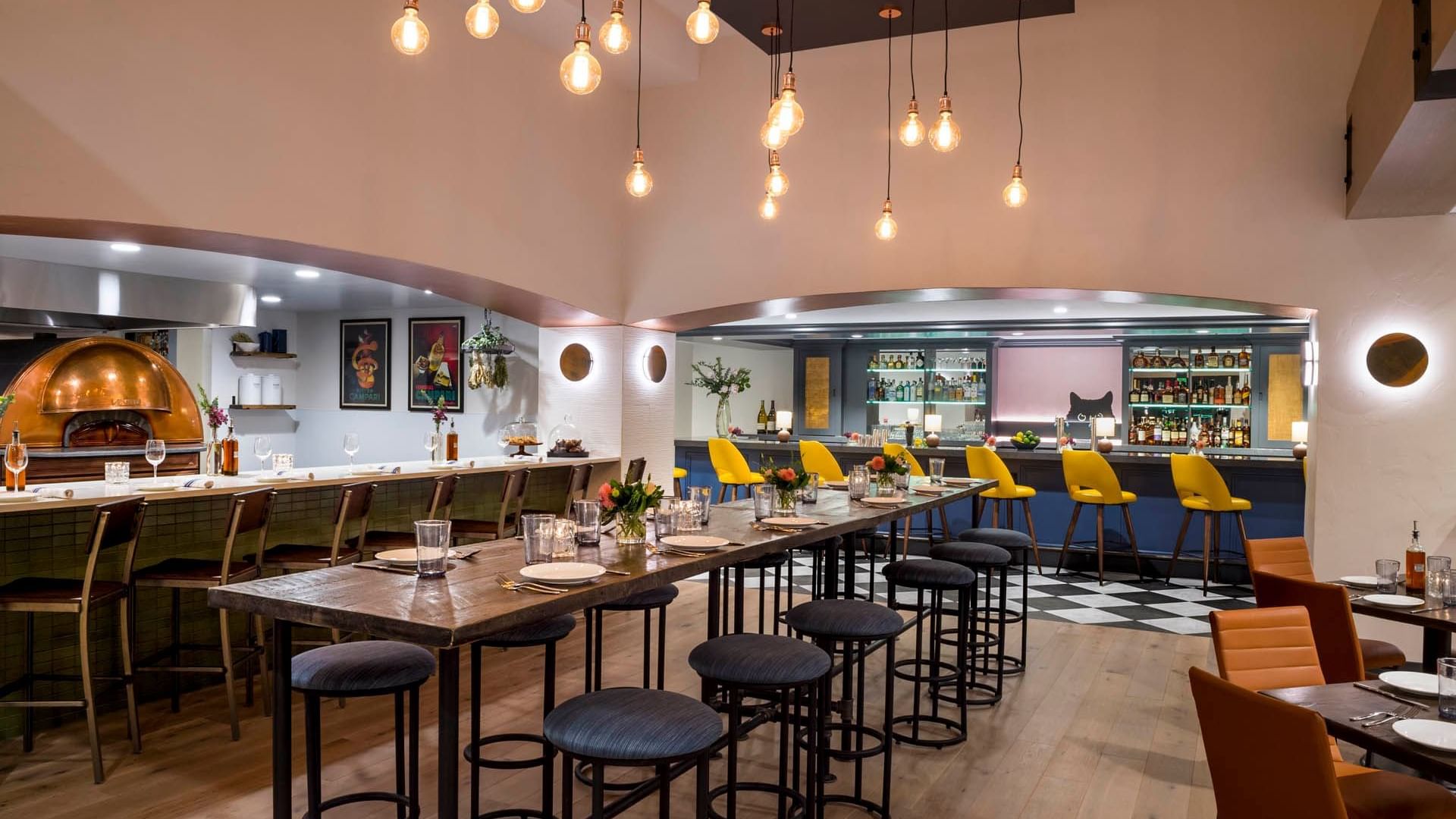 Bar counter and dining tables in Gattara Restaurant at Warwick Denver