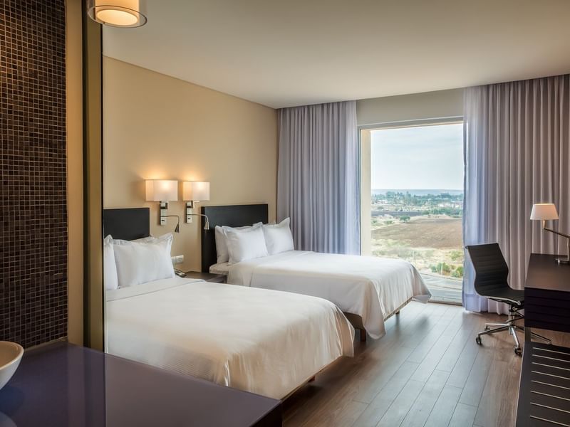 Twin beds in Superior Room with view at Fiesta Inn