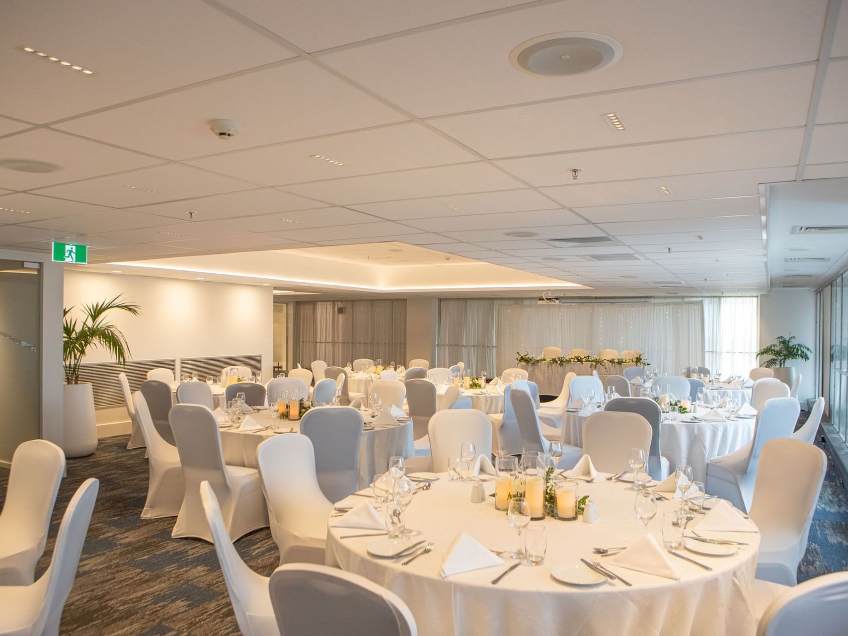 White themed banquet tables arranged in Chancellor 3 at James Cook Grand Chancellor
