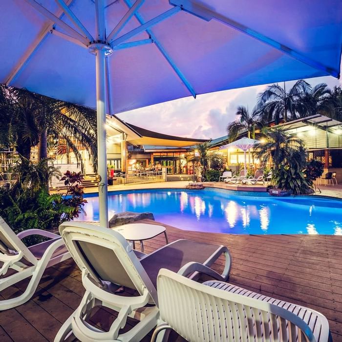 Sunbeds by the outdoor pool at Darwin Airport Hotels