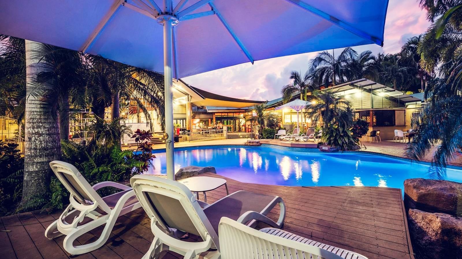 Sunbeds by the outdoor pool at Darwin Airport Hotels