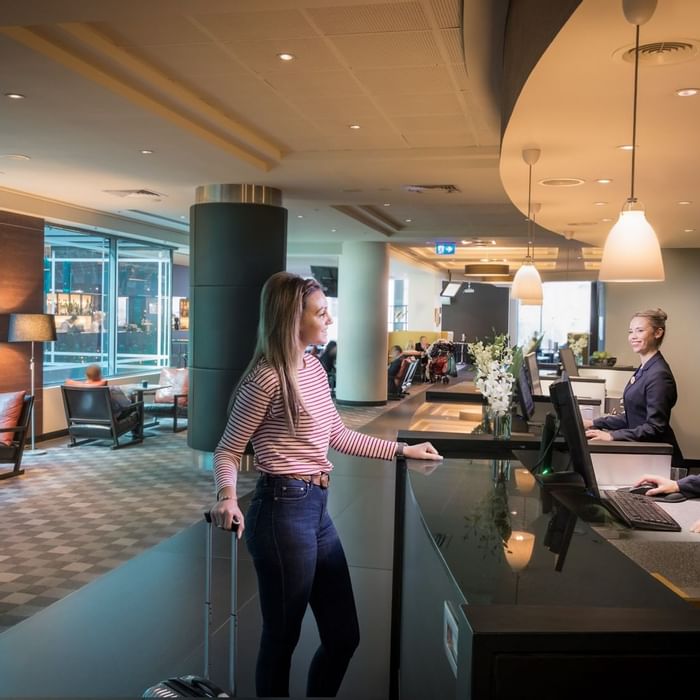 Guest checking into Novotel Melbourne On Collins