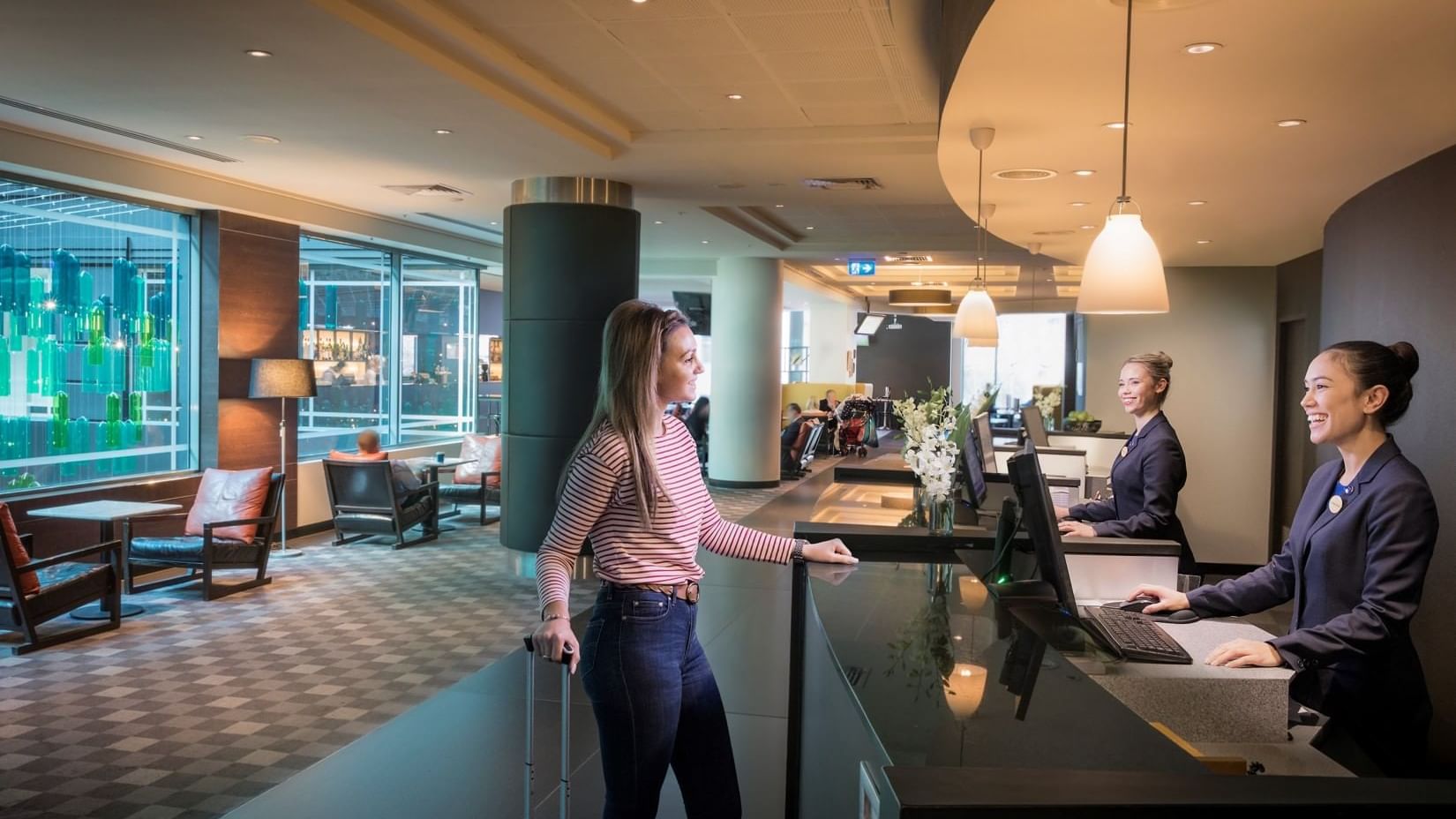 Guest checking into Novotel Melbourne On Collins