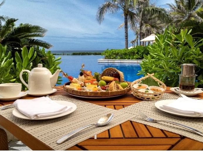 Afternoon tea & snacks served with a pool view at Wyndham Garden