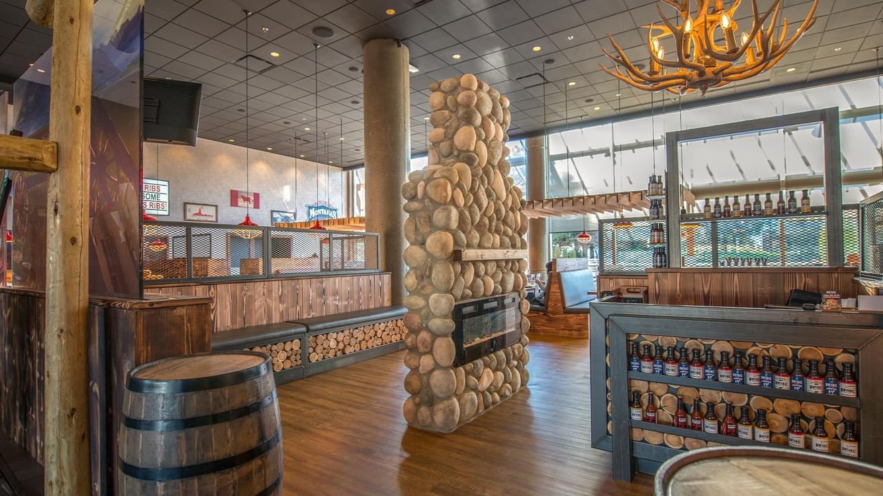 Wooden barrel and stone wall interior at Montana's BBQ & Bar.