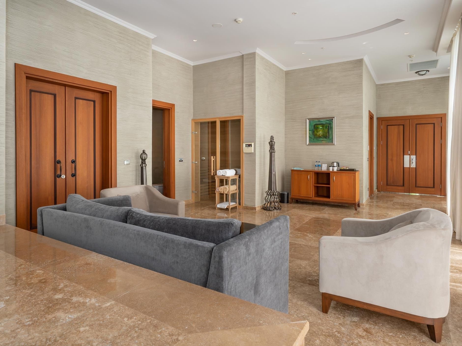 Living area with comfy couches in Ottoman Spa Suite at Titanic Deluxe Golf Belek