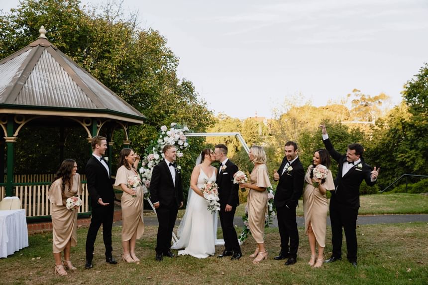 Wedded couple & party by the gazebo at Amora Hotel Melbourne