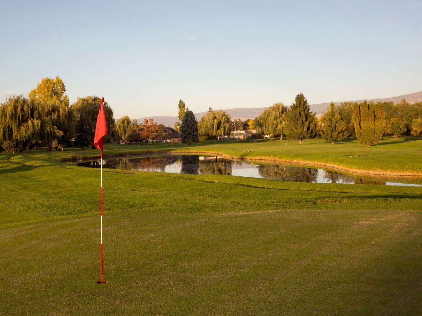 Flagpole by a lake in Mission creek Golf club, Hotel Eldorado