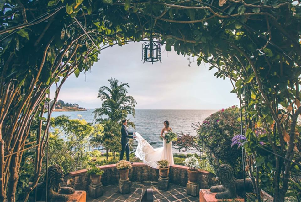 Wedding couple posing by the lake at Hotel Atitlan