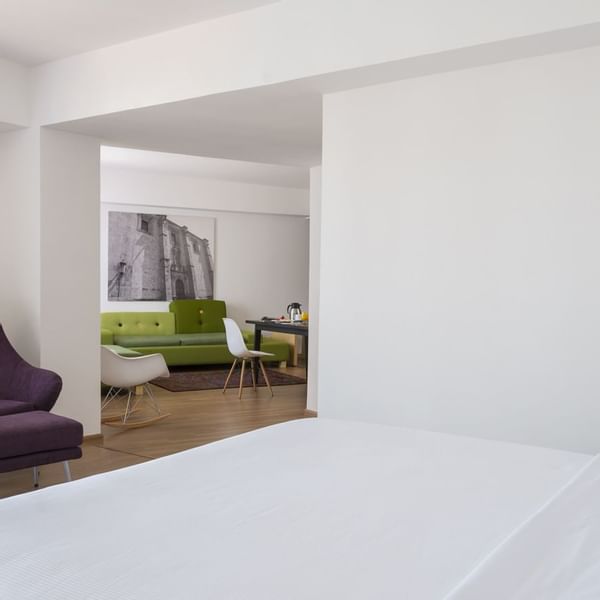 Interior of a room with a king bed in Mater Suite at Fiesta Inn