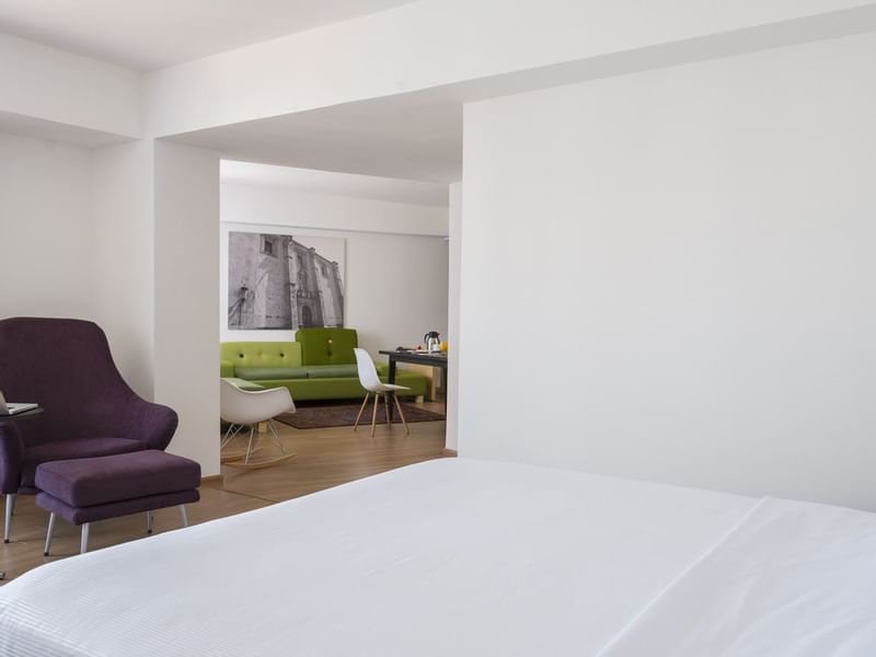 Interior of a room with a king bed in Mater Suite at Fiesta Inn