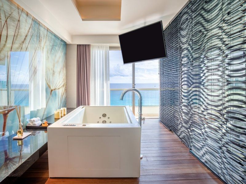Bathtub and amenities in Suite Presidencial Sol Y Luna at Live Aqua Cancún