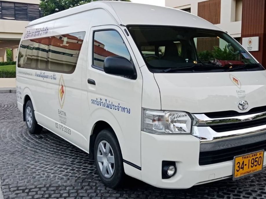 Transportation service van parked by the motor lobby at Eastin Hotels