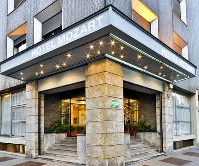 Exterior view of Hotel Mozart in Milan on a sunny day