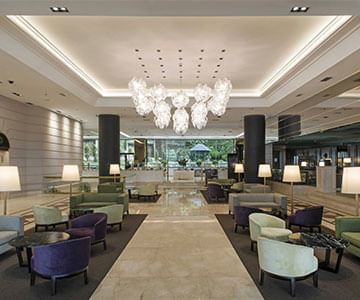 Chandelier lights & sofas in Hotel Emperador Buenos Aires