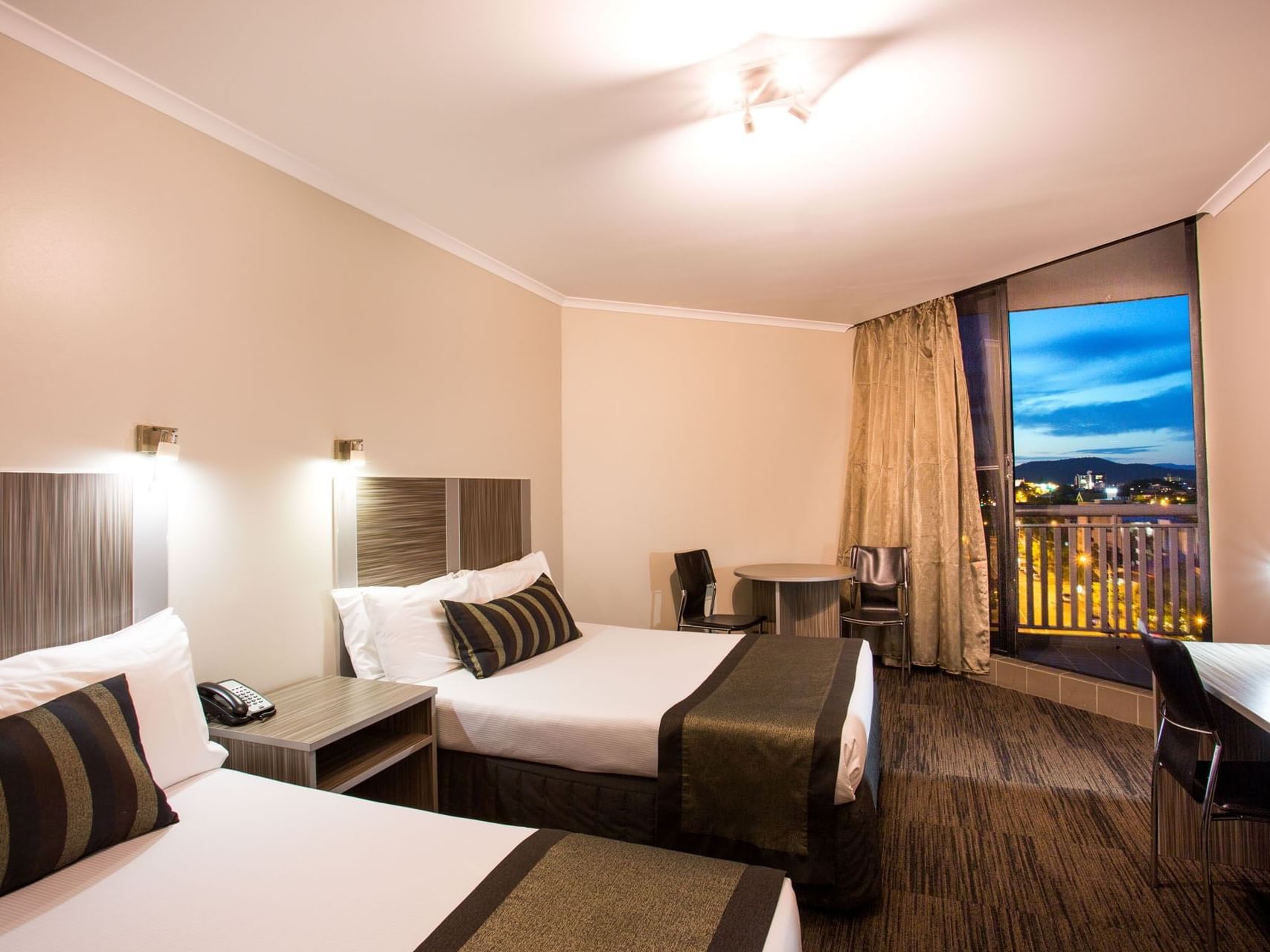 Deluxe Twin Room with night view at Grand Chancellor Brisbane