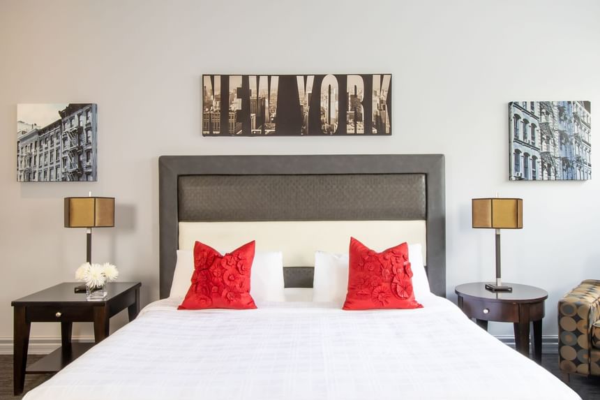 Comfy bed, pillows & bedside tables with lamps in King Superior Manhattan at Retro Suites Hotel