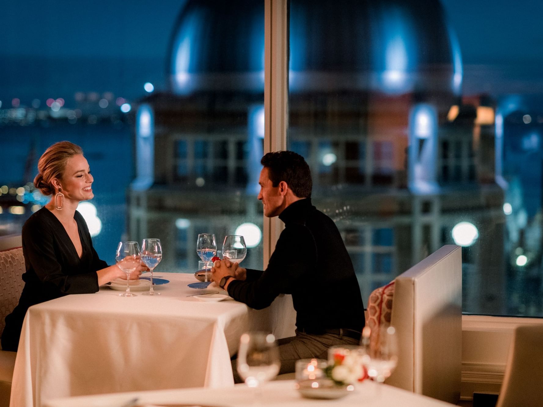 Couple having romantic dinnar at the Boston harbor Hotel