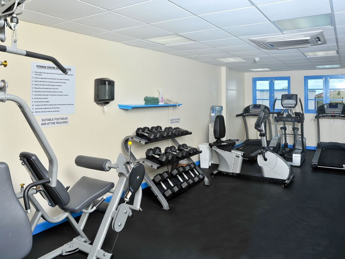 Modern interior of Fitness Center with treadmills and a set of dumbbells at Rostrevor Hotel