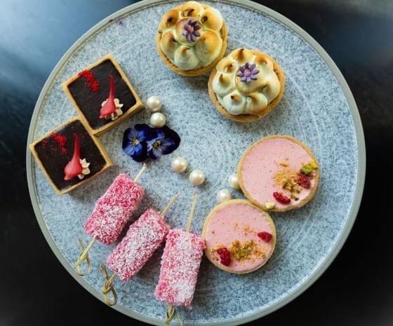 Plate filled with a variety of sweet treats served at Amora Hotel Jamison Sydney