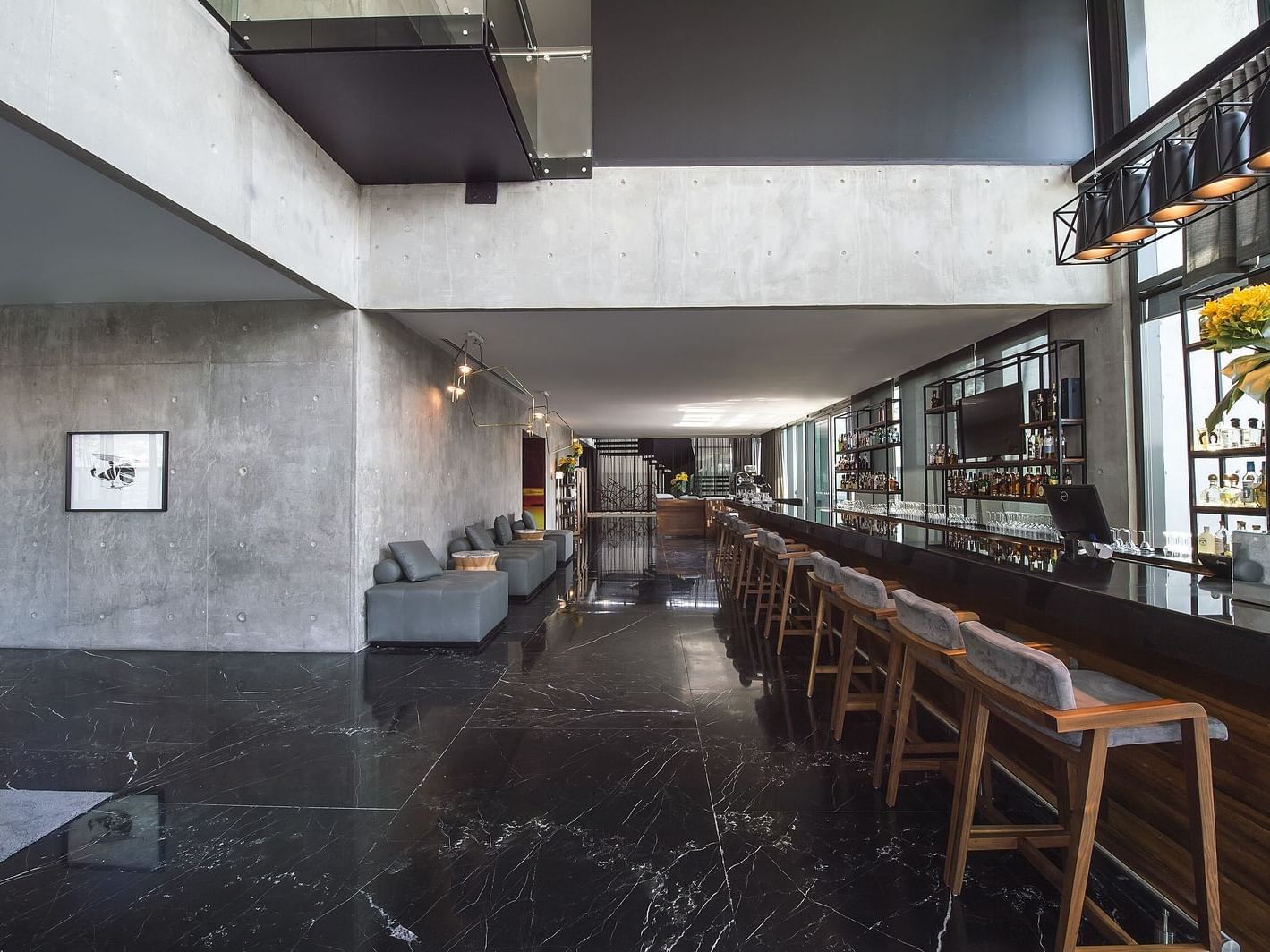 Counter with high chairs in Serrano Bar at La Colección Resorts