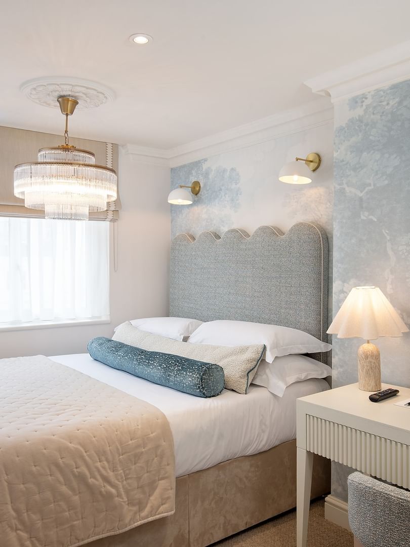 Elegantly decorated penthouse bedroom with a king-size bed at The Capital Hotel, Apartments & Townhouse