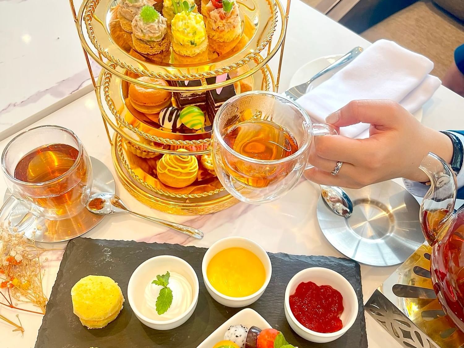 A couple enjoying an afternoon tea buffet at Eastin Hotels