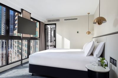 King bed & TV in business room at Brady Hotels Jones Lane