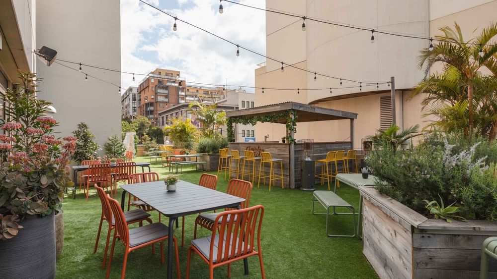 Outdoor bar and dining area with string lights & artificial turf in the Hunter Room 1-4 at Novotel Sydney on Darling Harbour