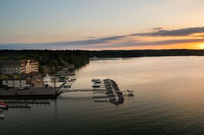 An Aerial view of Chase on The Lake hotel and lake at sunset 