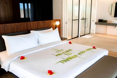 Stylish Water Pool Villas room at Ananea Madivaru Maldives with a welcoming bed and a modern bathroom