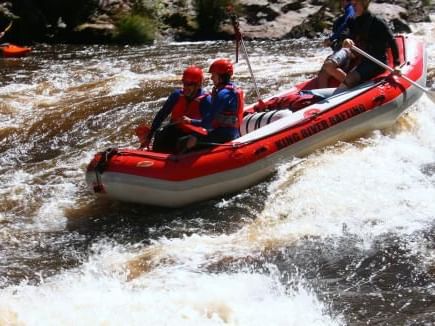 People water rafting at king River near the Strahan Village