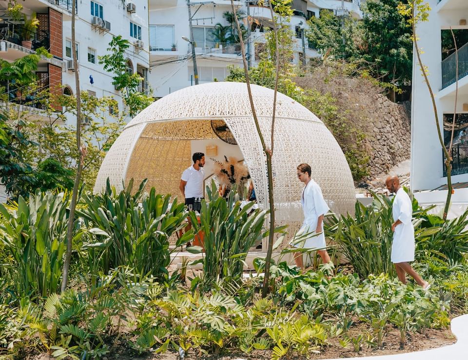 People in robes next to the outdoor spa area at Almar Beach Resort