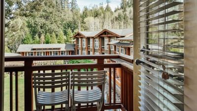 Balcony with two chairs in Courtyard King at Alderbrook Resort & Spa