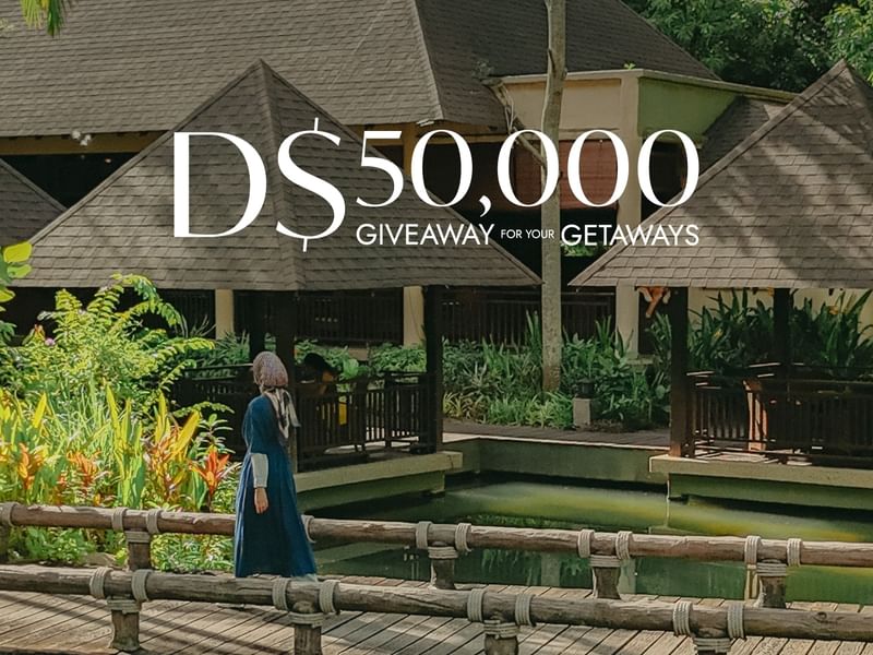 Women crossing hot spring bridge promoting GHA Scavenger Hunt D$50,000 giveaway