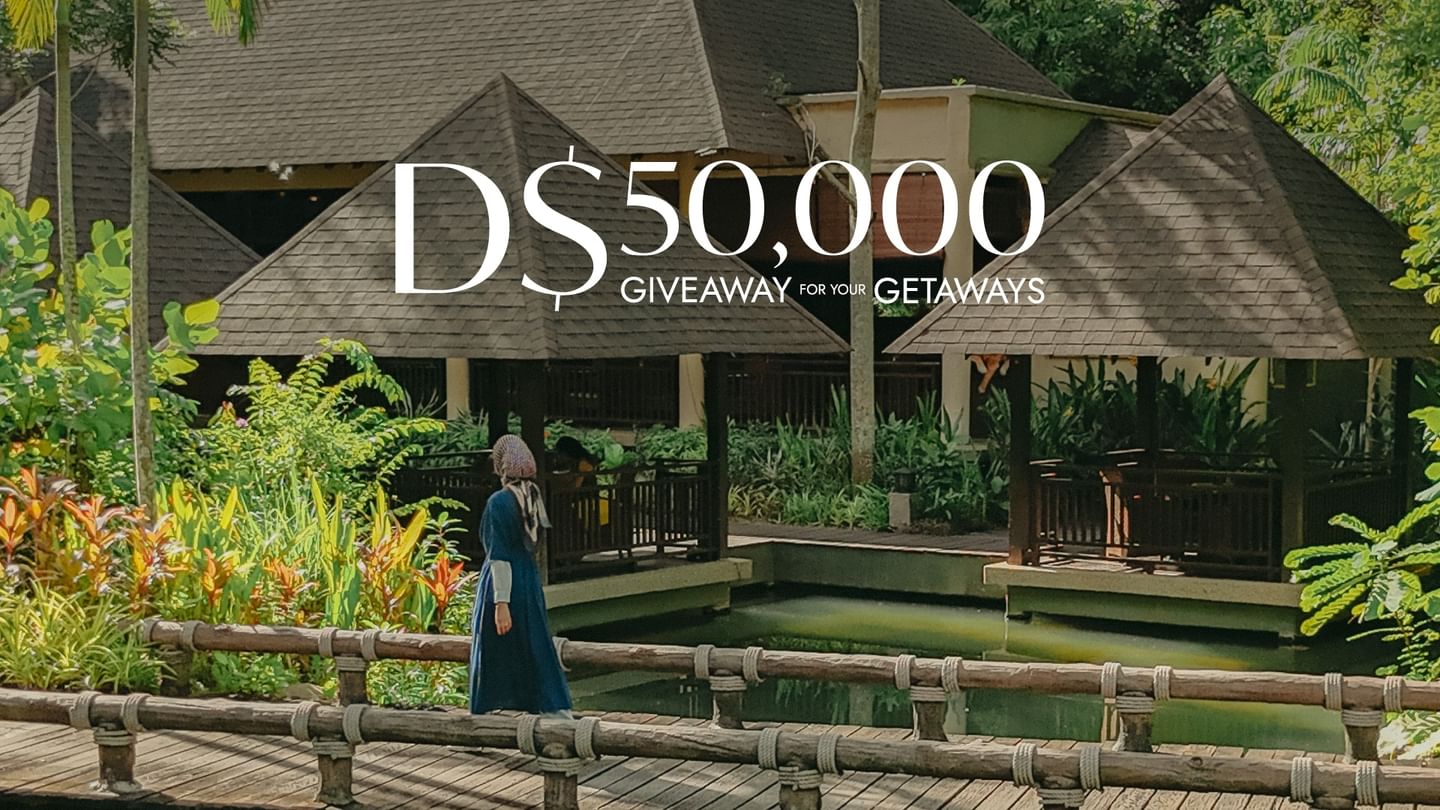 Women crossing hot spring bridge promoting GHA Scavenger Hunt D$50,000 giveaway