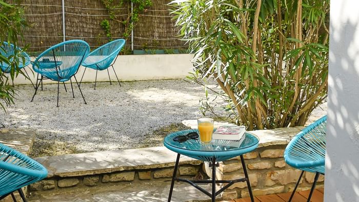 Garden chairs in Le Villa West & Spa at The Originals Hotels