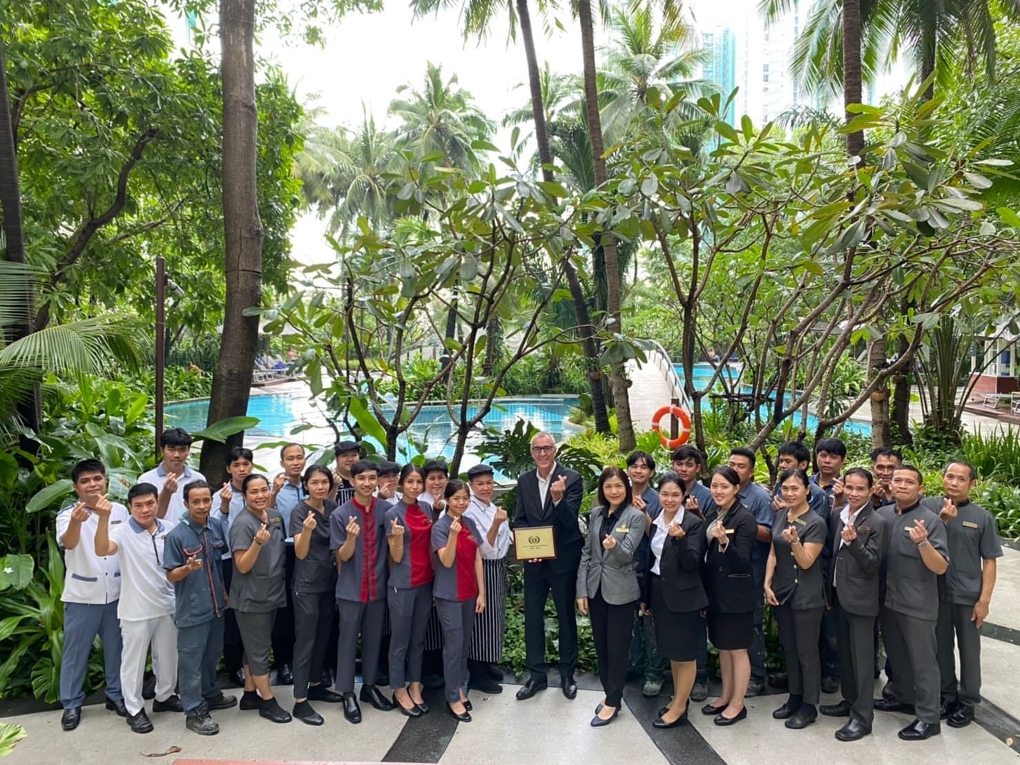 General Manager & staff posing at Chatrium Residence Sathon