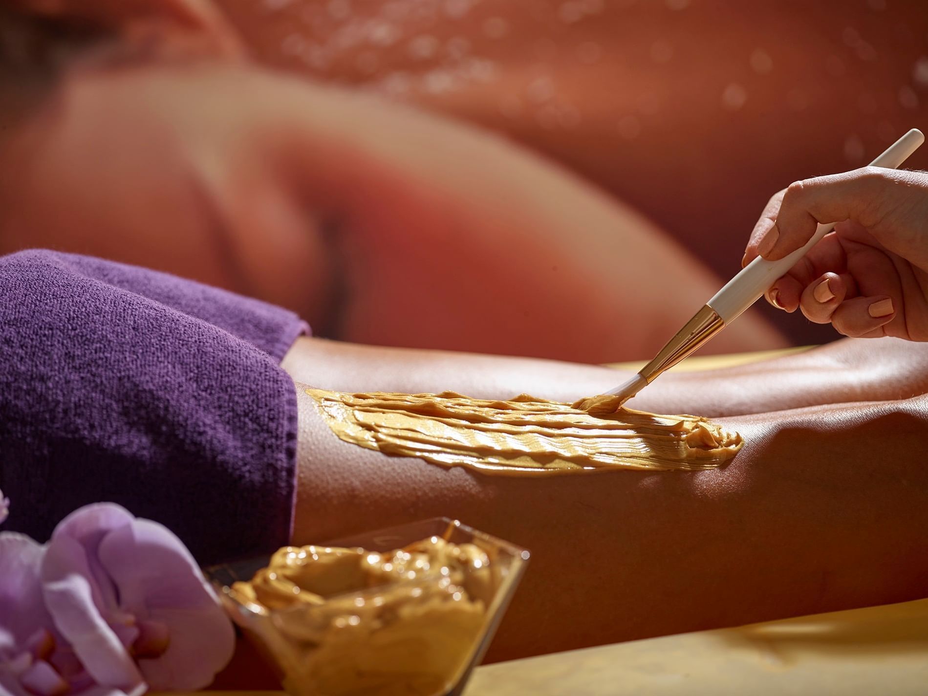 A person applying Therapeutic Substance on skin in the Spa at Ana Hotels Europa