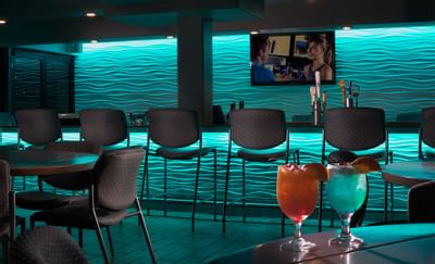 two cocktails in a bar area