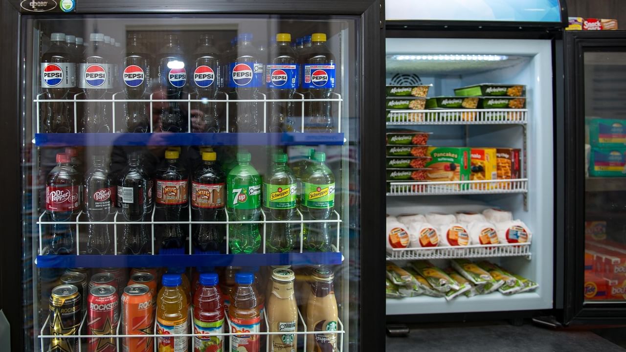 Fridge with drinks and snacks.