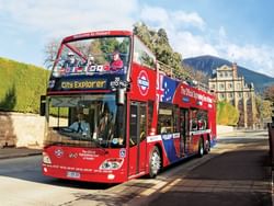 Passengers enjoying a ride on the Red Decker bus in Hobart near Hotel Grand Chancellor Hobart