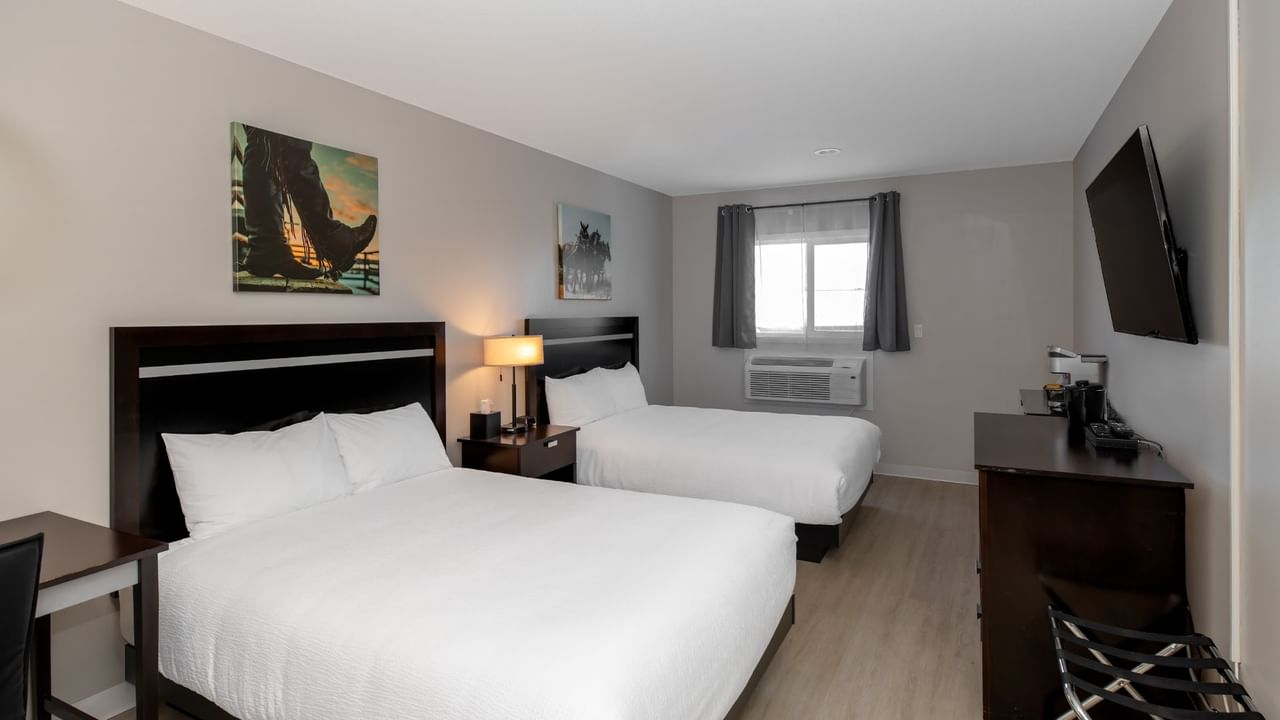 Guest room at Coast Innisfail Hotel with two queen beds and desk