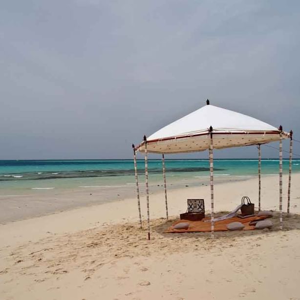 A sandbank picnic setup by the sea at Zanzibar Serena Hotel